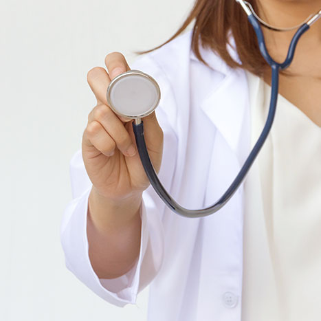 A doctor holding a stethoscope.